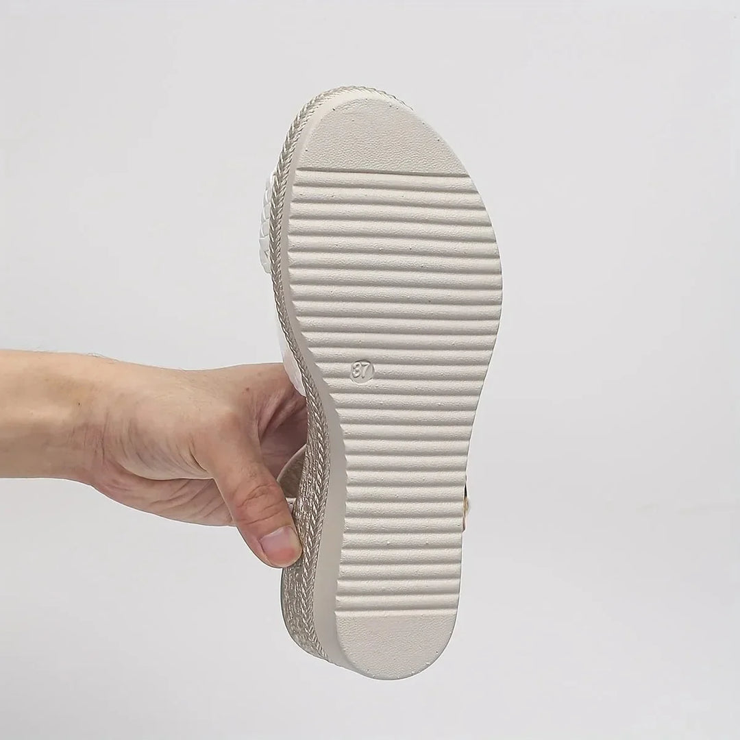 Chic white platform wedge sandals for women, featuring braided straps and a comfortable open-toe design.