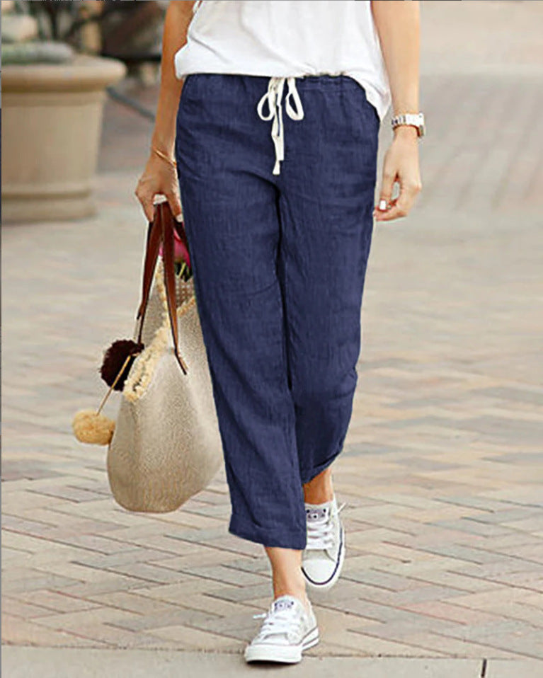 Relaxed fit women's linen cropped pants, polished finish, comfortable drawstring waist, ideal for everyday style.