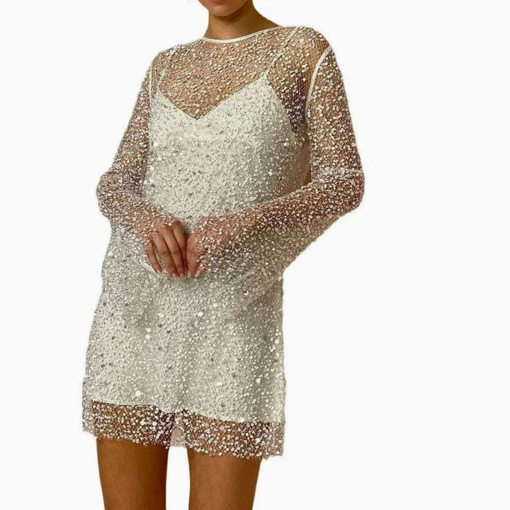 Dazzling women's sequin long sleeve mini dress, perfect as a party, cocktail or evening dress. Sparkly fashion.