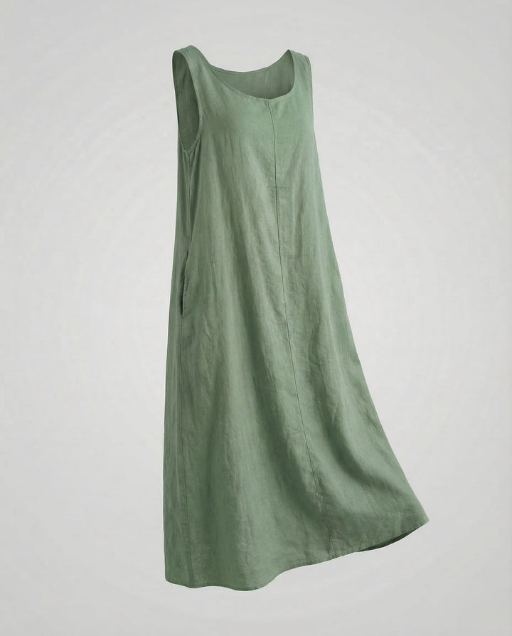 Elegant sleeveless A-line maxi dress for women, featuring a stylish design and practical pockets.