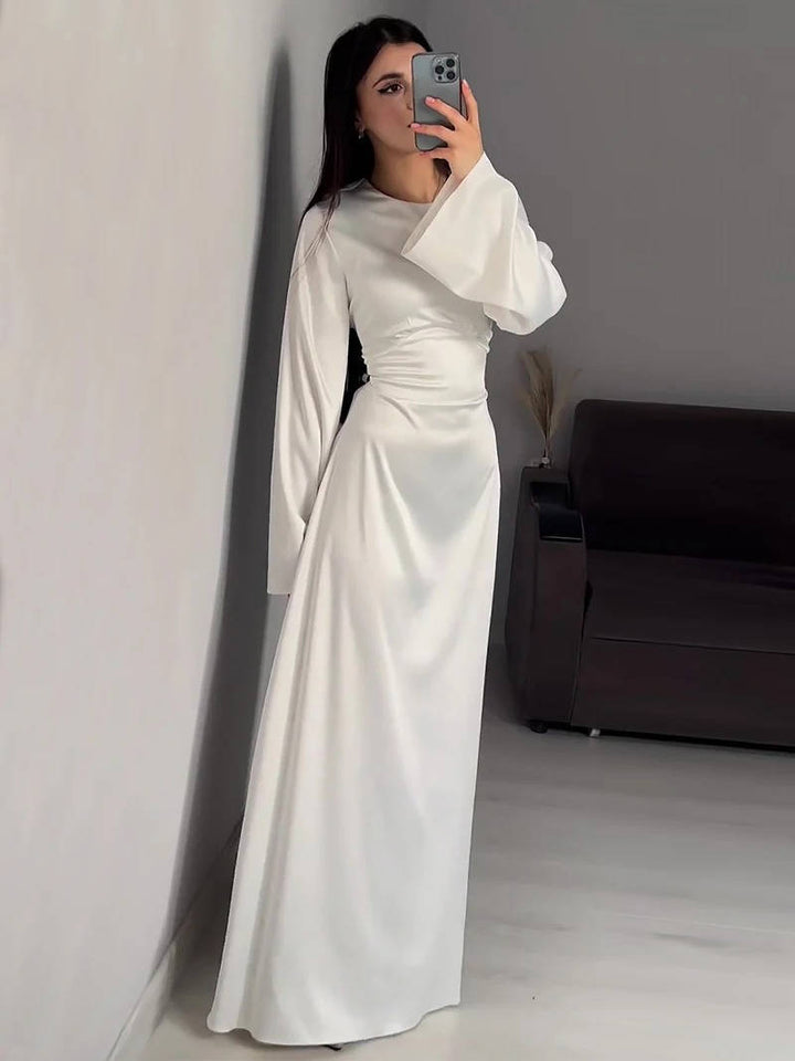 Sophisticated women's long dress, a maxi style with beautiful flared sleeves for parties.