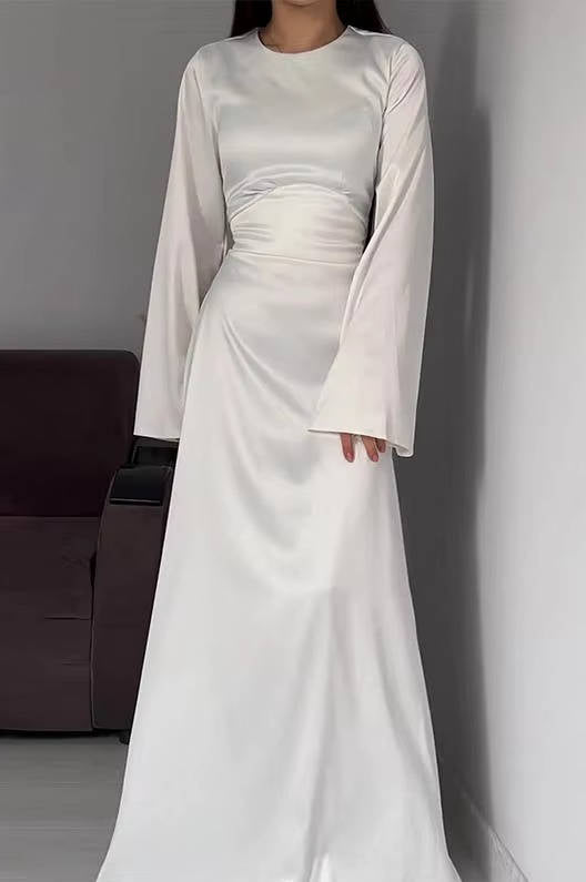 Women's elegant evening gown, a maxi dress with unique flared sleeves, formal attire.