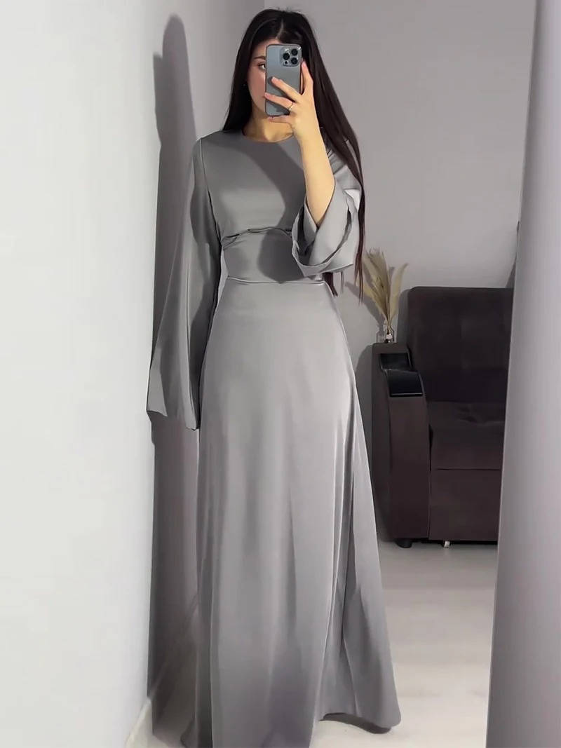 Beautiful women's special occasion dress, a maxi gown with elegant flared sleeves.