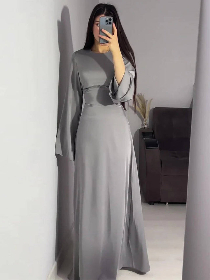 Beautiful women's special occasion dress, a maxi gown with elegant flared sleeves.