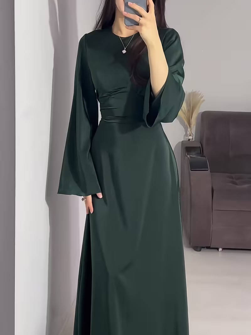 Flowy elegant women's evening gown with long flared sleeves, suitable for formal events.