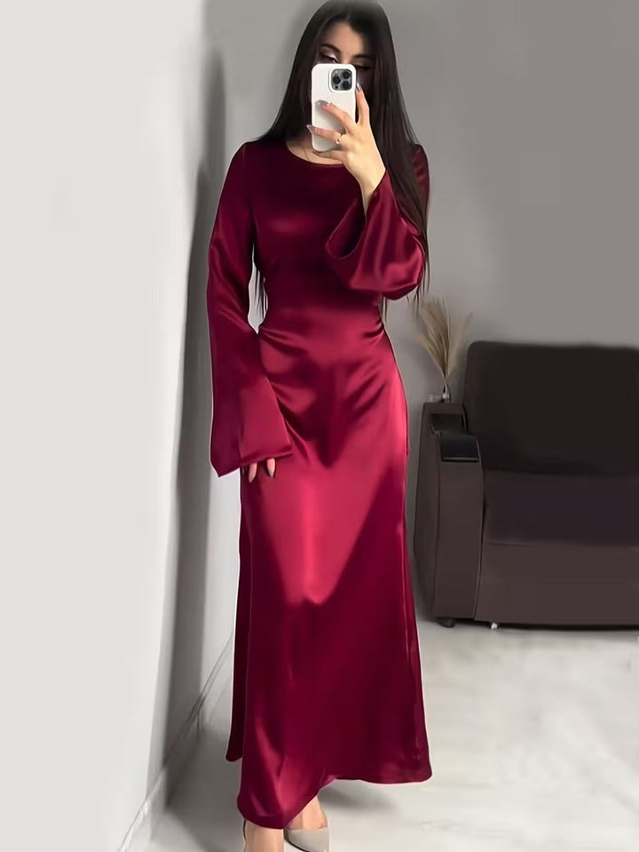 Stylish women's party dress, a long maxi style with statement flared sleeves.