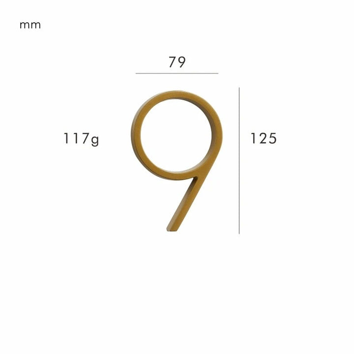 Artistic brass house number sign, blending a modern aesthetic with classic satin metal appeal.