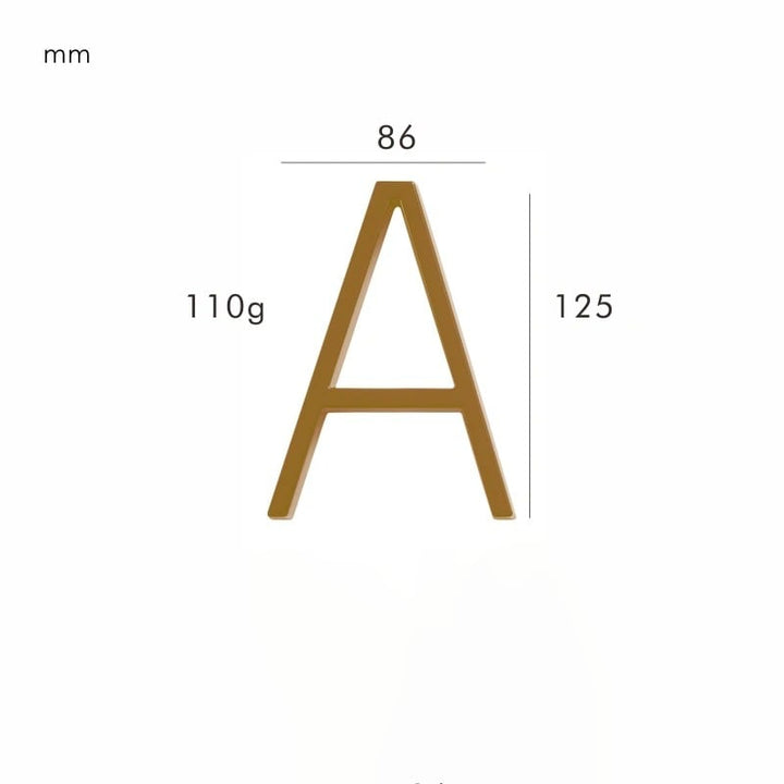 Sophisticated satin brass house number for exterior walls, improving home's curb appeal.