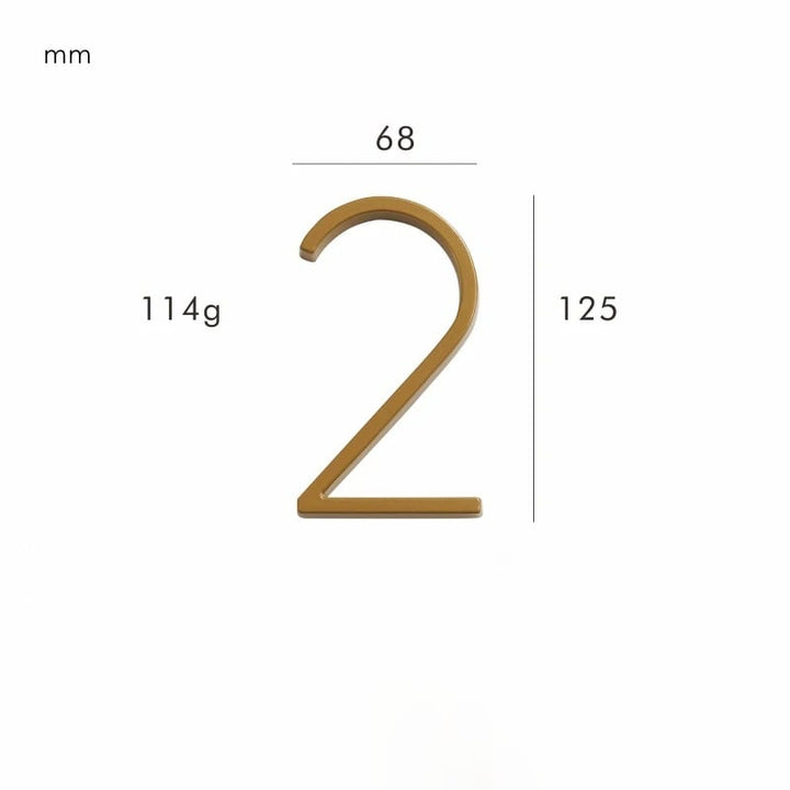 Stylish satin brass door number plaque, a durable metal sign for exterior home decor.