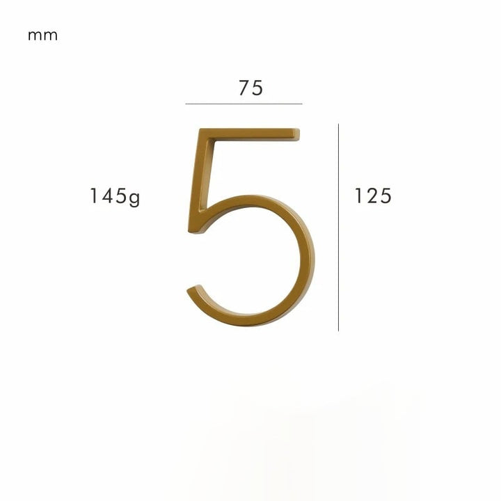 Close-up of a satin brass house number, showcasing its elegant finish and clear typography.
