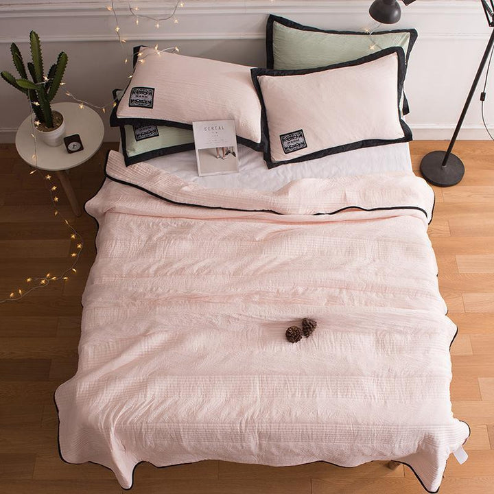 Breathable bamboo cotton cooling summer blanket for refreshing night's sleep.