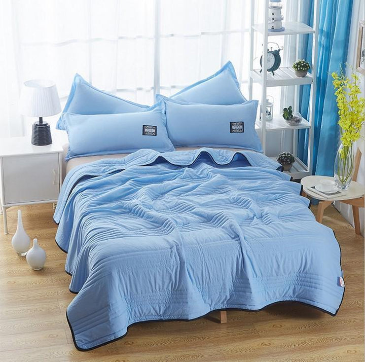Soft, breathable cooling blanket (CoolBreeze) for summer. Lightweight bamboo cotton bedding for ultimate hot weather comfort.