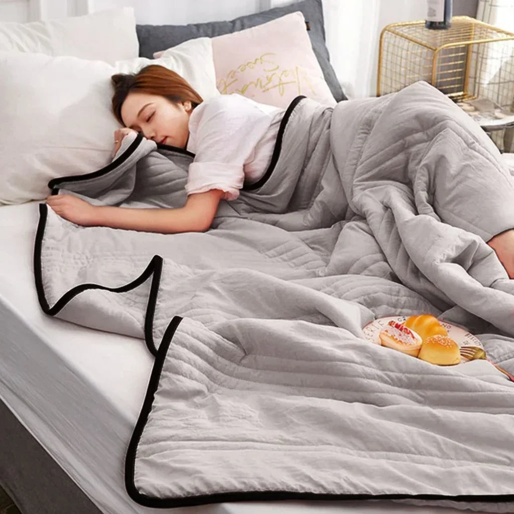 Unisex breathable bamboo cotton cooling blanket for hot summer nights. Soft, lightweight bedding for refreshing sleep.