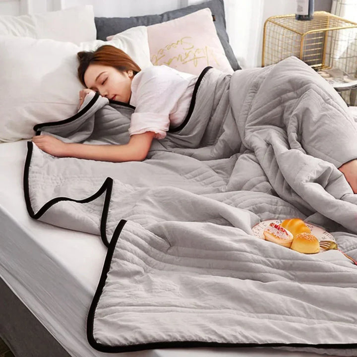 Unisex breathable bamboo cotton cooling blanket for hot summer nights. Soft, lightweight bedding for refreshing sleep.