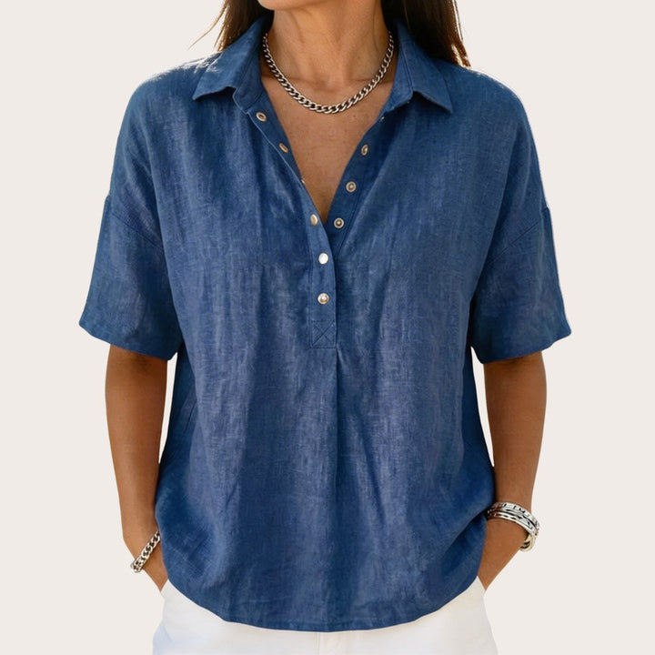 Women's classic relaxed fit button-up shirt. Everyday long-sleeve blouse, versatile for casual or chic looks.