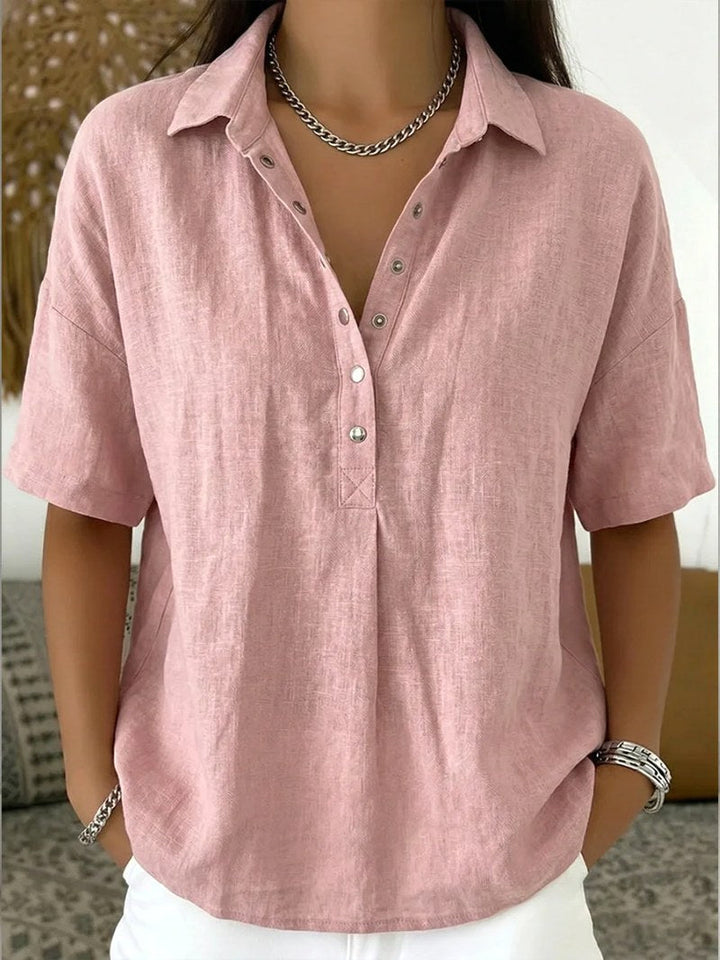 White women's relaxed fit button-up shirt. Classic long-sleeve blouse, versatile for layering & daily wear.