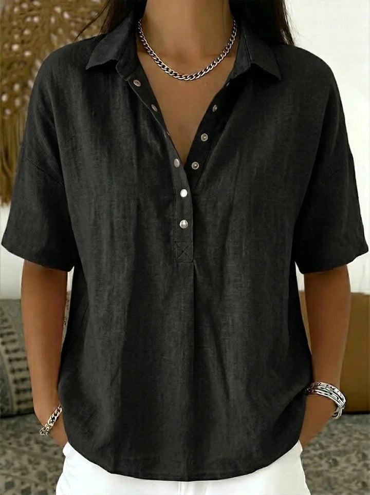 Comfortable women's relaxed fit button-up shirt. Modern long-sleeve blouse, perfect for versatile everyday style.