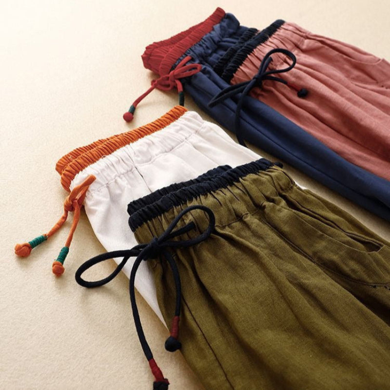 White women's drawstring pants, relaxed fit for versatile casual wear, summer fashion, and comfortable lounging.