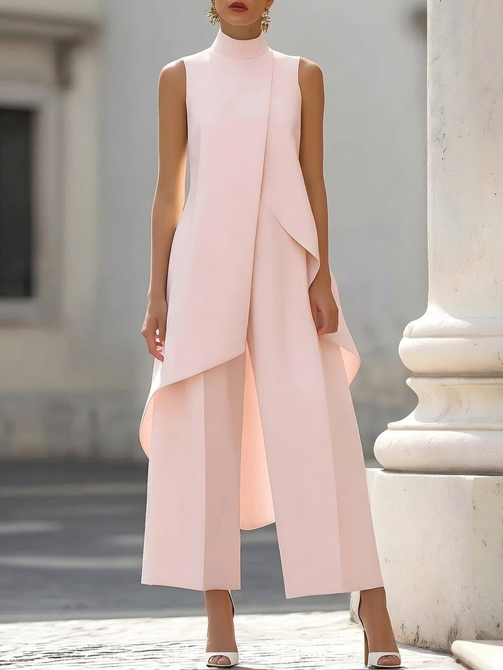 Modern women's co-ord set: high-neck asymmetric top and wide-leg trousers, ideal for professional wear.