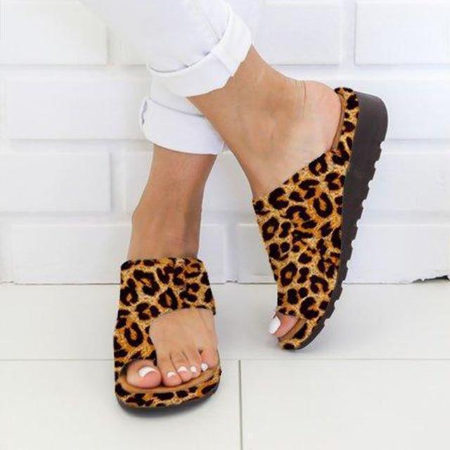 Leopard print platform bunion sandals, offering stylish foot relief with adjustable strap.