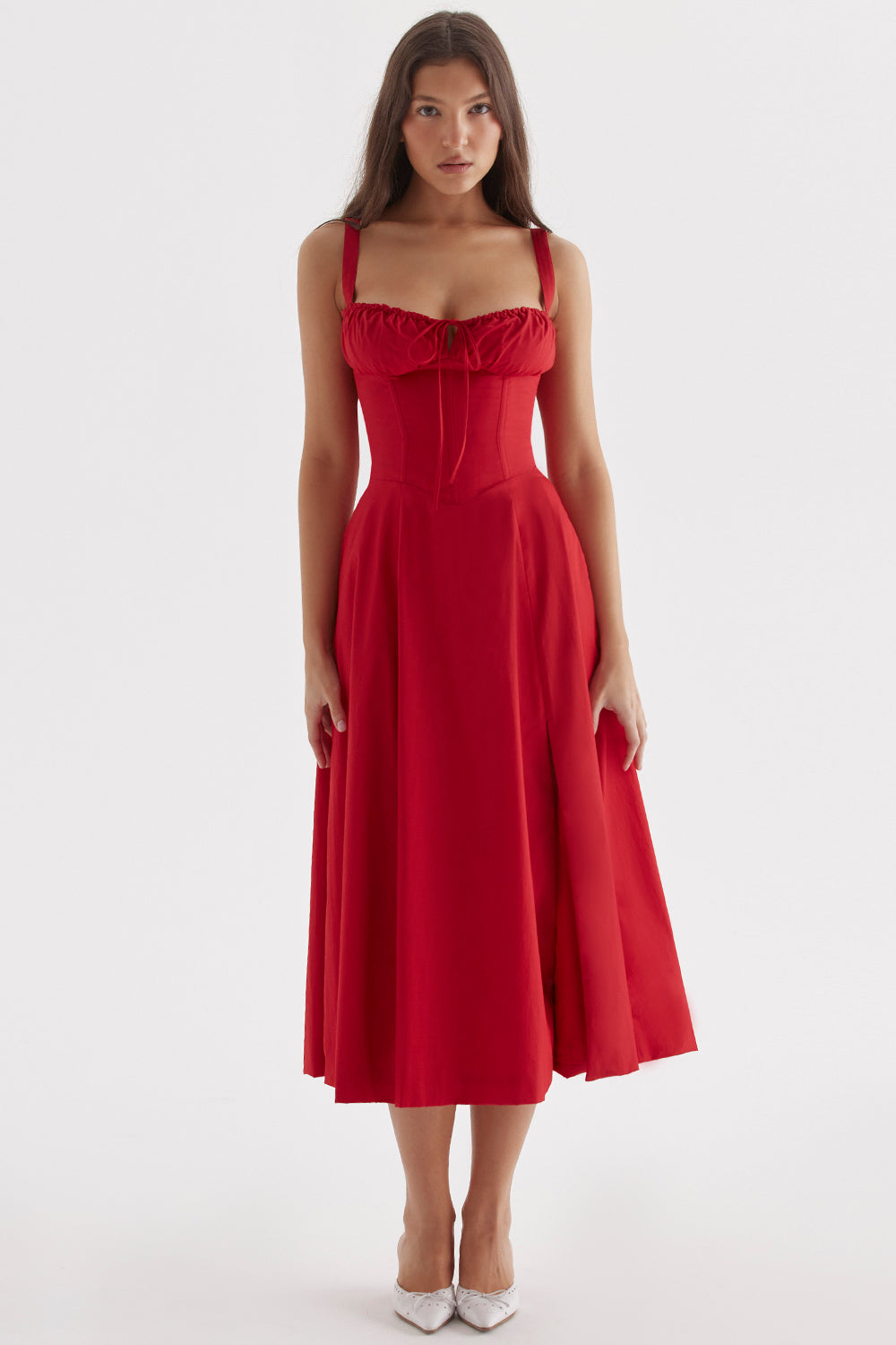 Women's elegant bustier floral dress on a hanger, ready for a special occasion or summer party.