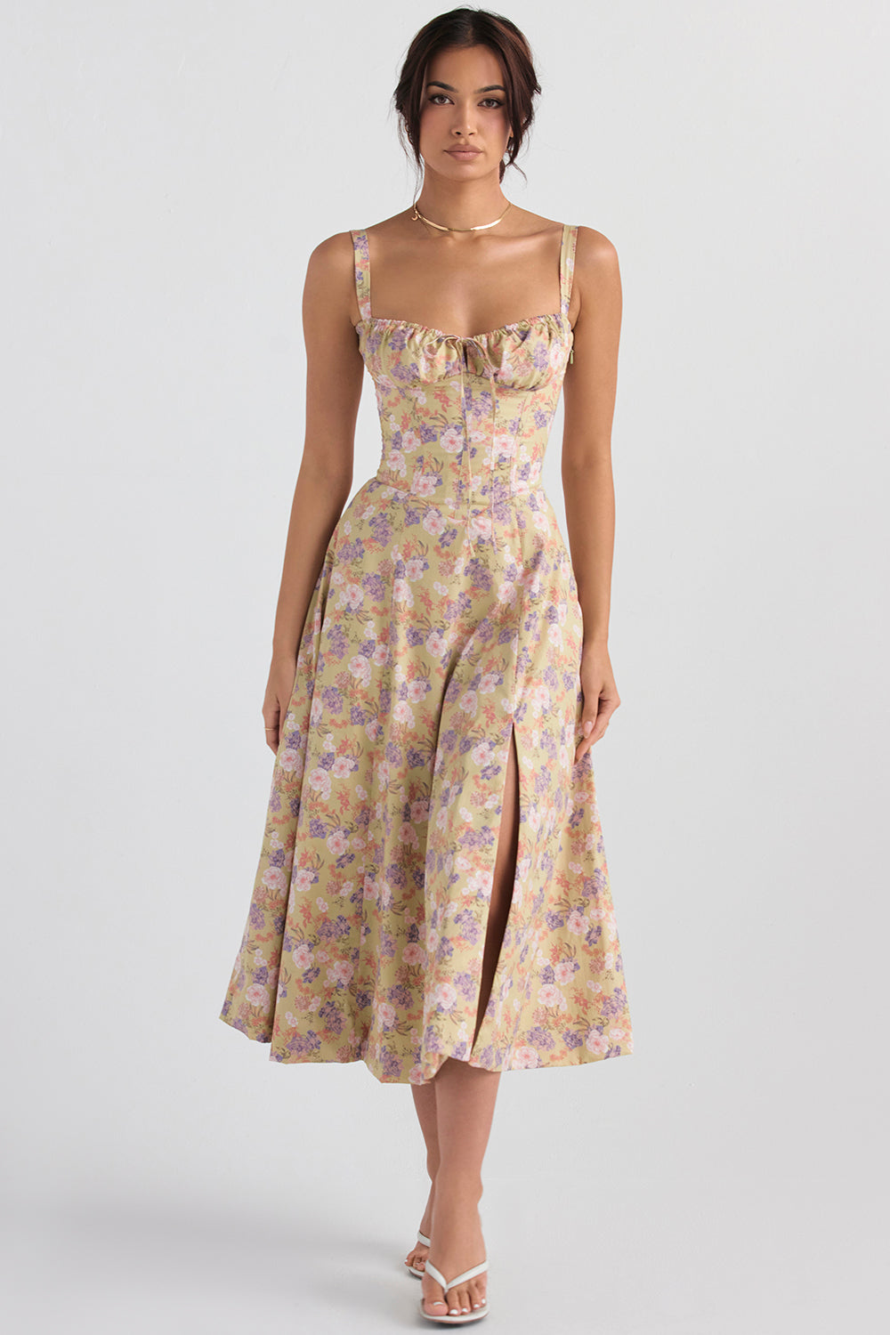 Model wearing an elegant bustier floral cocktail dress, ideal for parties & special occasions.