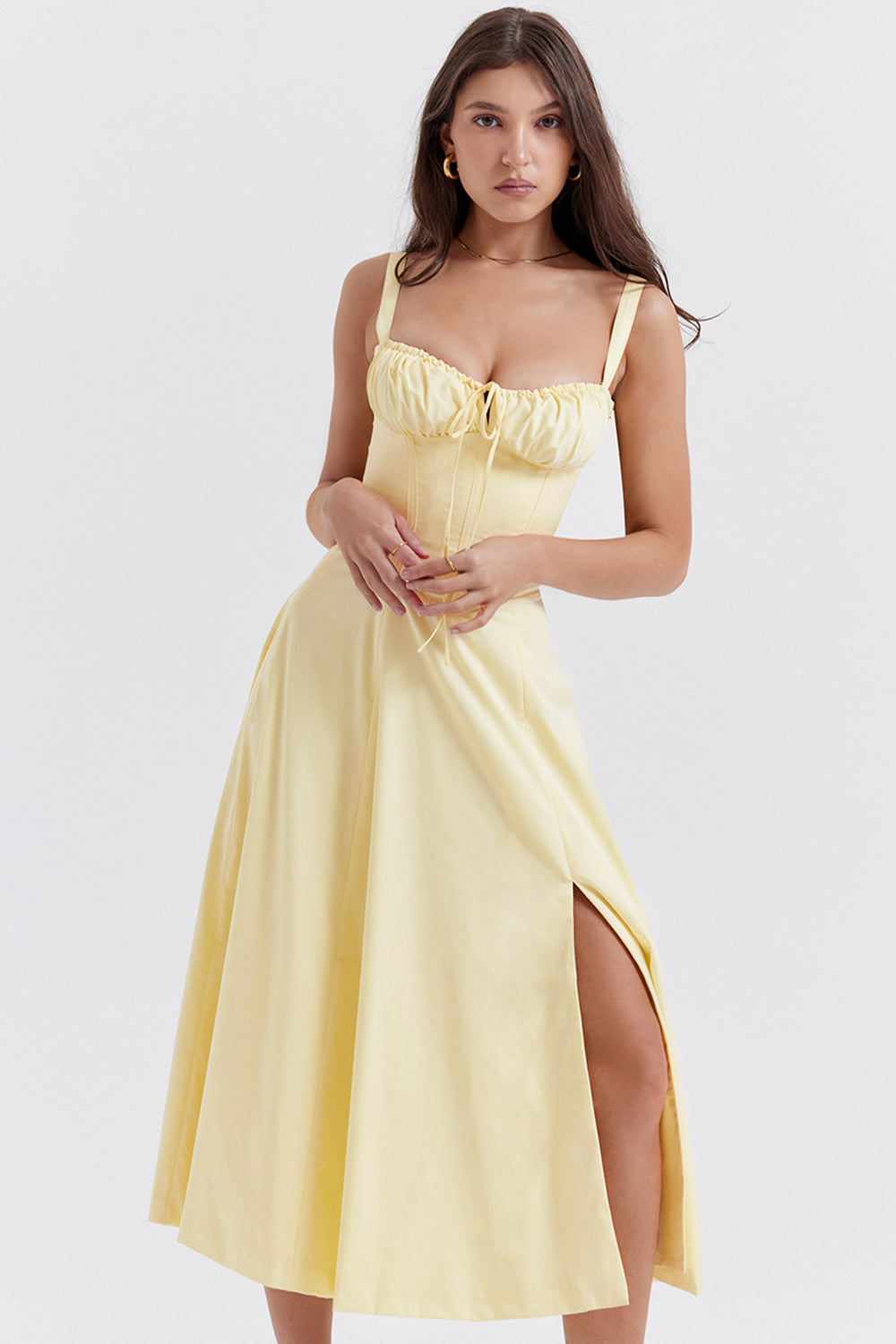 Full-length shot of a figure-flattering women's bustier floral dress with elegant waist-shaping.