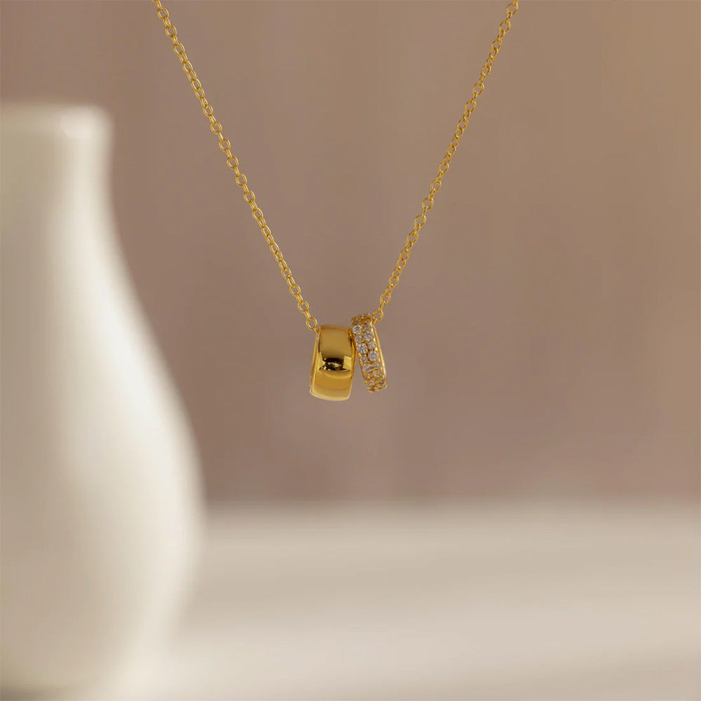 Sleek alloy necklace for women with an elegant double circle and duo ring pendant. Modern minimalist jewelry.