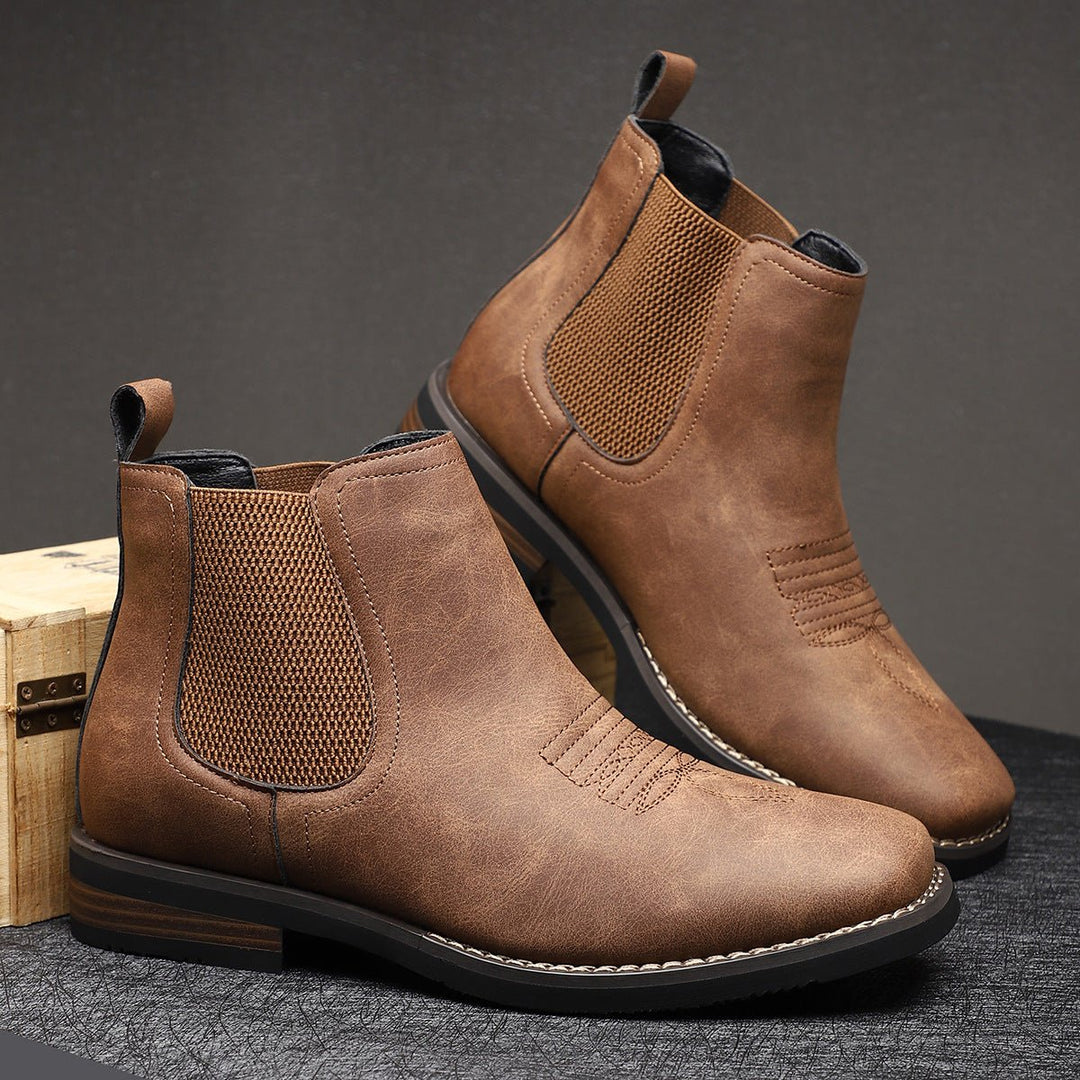 Fashionable men's Chelsea boots, easy slip-on, suitable for dress or casual wear. Comfortable everyday footwear.