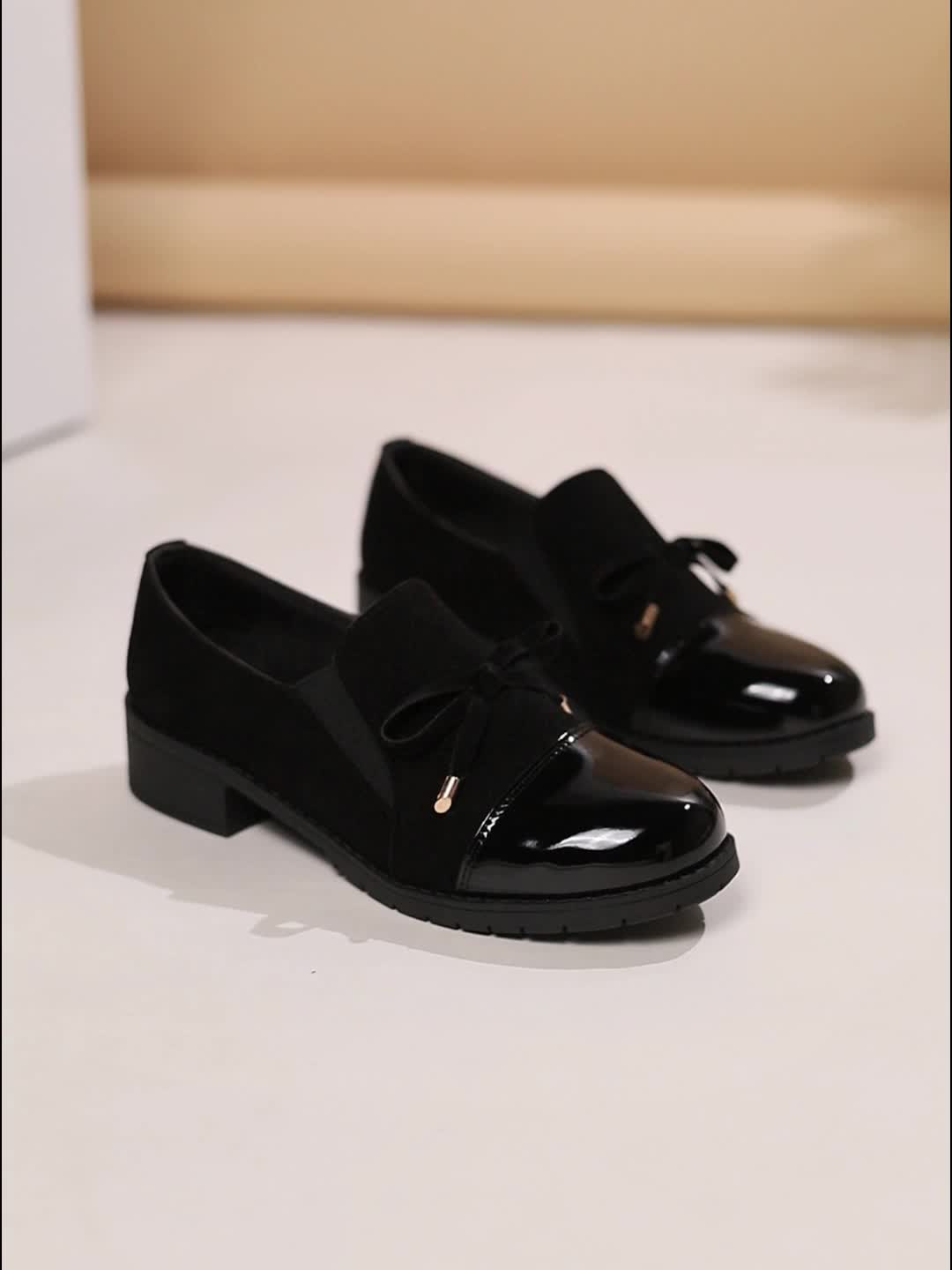 Everyday brown women's loafers, a classic slip-on shoe with a refined bow detail and low heel.