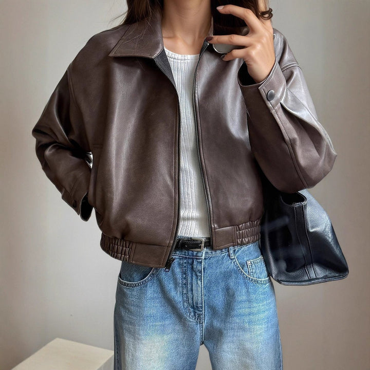 Stylish women's zip-up leather bomber jacket, a modern outerwear piece perfect for everyday wear.