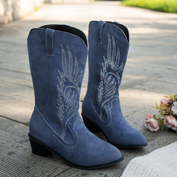Elegant women's wide-calf western boots, showcasing authentic cowboy fashion with a pointed toe design.