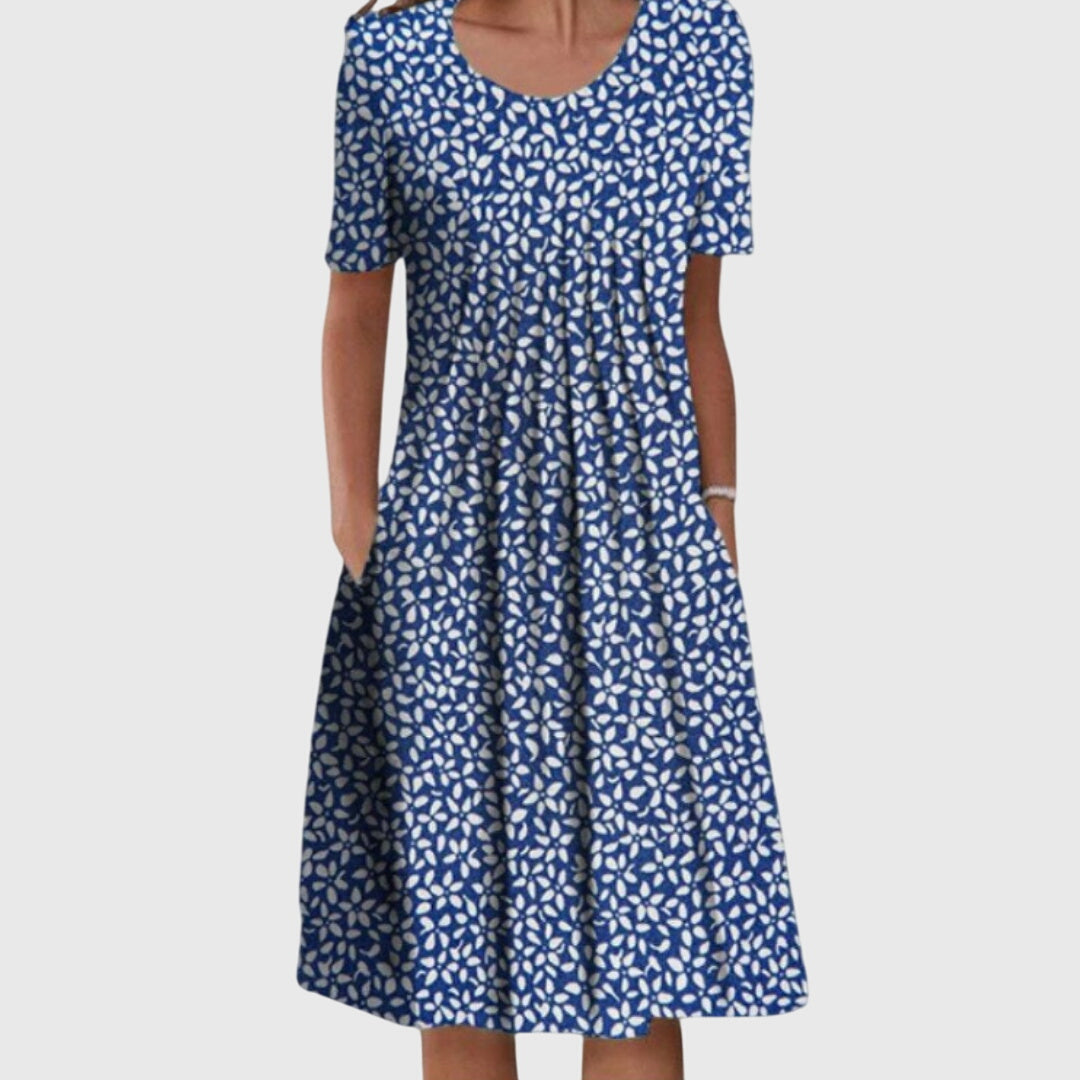 Chic women's floral printed round neck dress. A versatile midi style with layered fabric, great for summer.