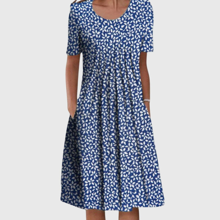 Chic women's floral printed round neck dress. A versatile midi style with layered fabric, great for summer.