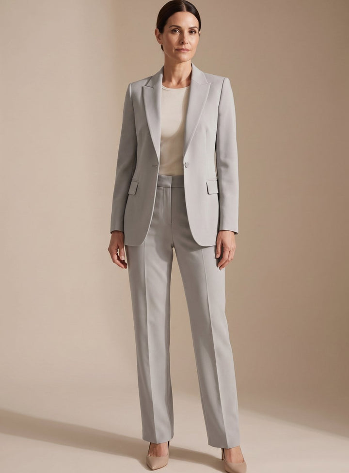 Stylish women's elegant two-piece suit: a chic blazer & sophisticated flared trousers for professional office wear.