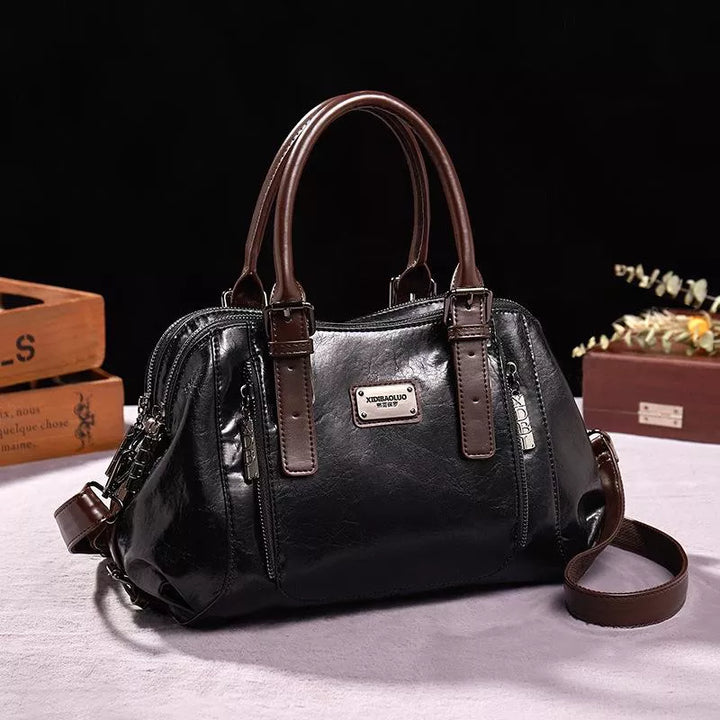 Premium leather shoulder bag for women, designed for everyday elegance with a secure magnetic closure.
