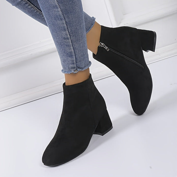 Modern women's elegant Chelsea ankle boots. Comfortable block heel, perfect for stylish fall & winter fashion.