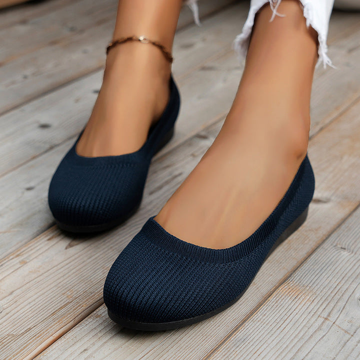Close-up: Non-slip sole on women's slip-on comfort sneakers, ensuring secure walking.