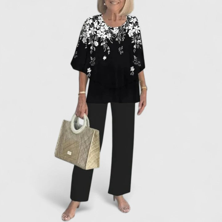 Elegant women's two-piece outfit, ideal for summer. Relaxed fit top & trousers for casual chic versatility.