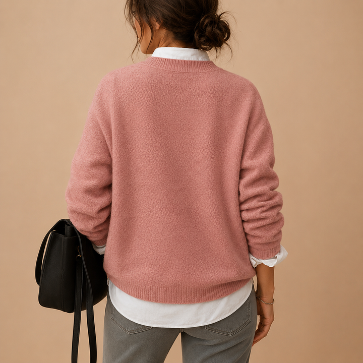Cozy long-sleeve knit sweater for women, an elegant pullover offering comfort for everyday wear.