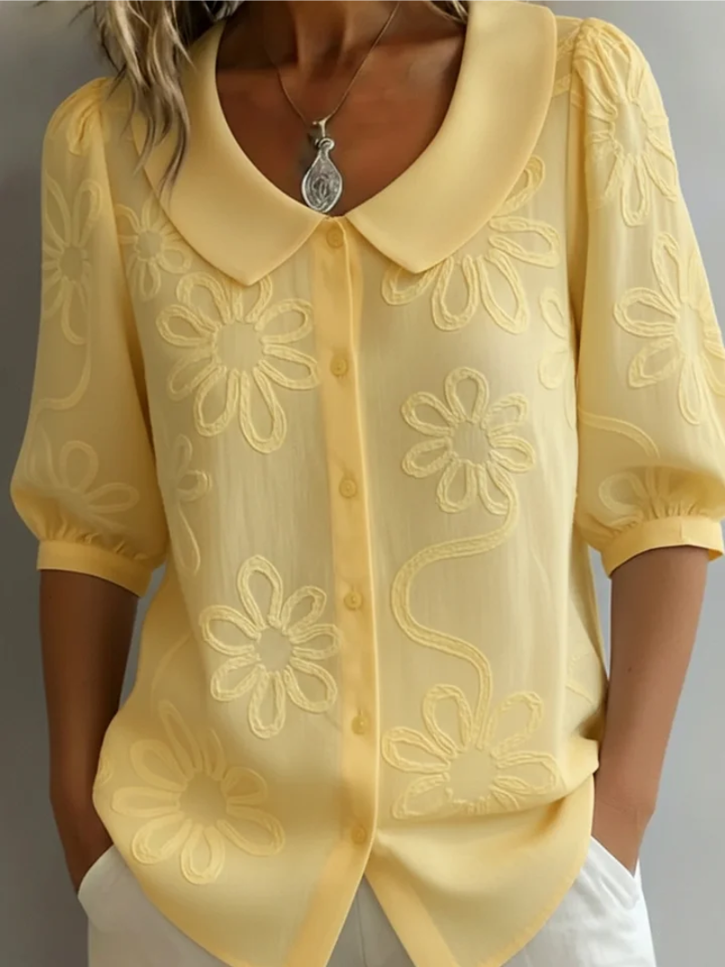 Elegant women's embroidered floral blouse with short sleeves, perfect for stylish everyday wear. Chic and versatile summer top.