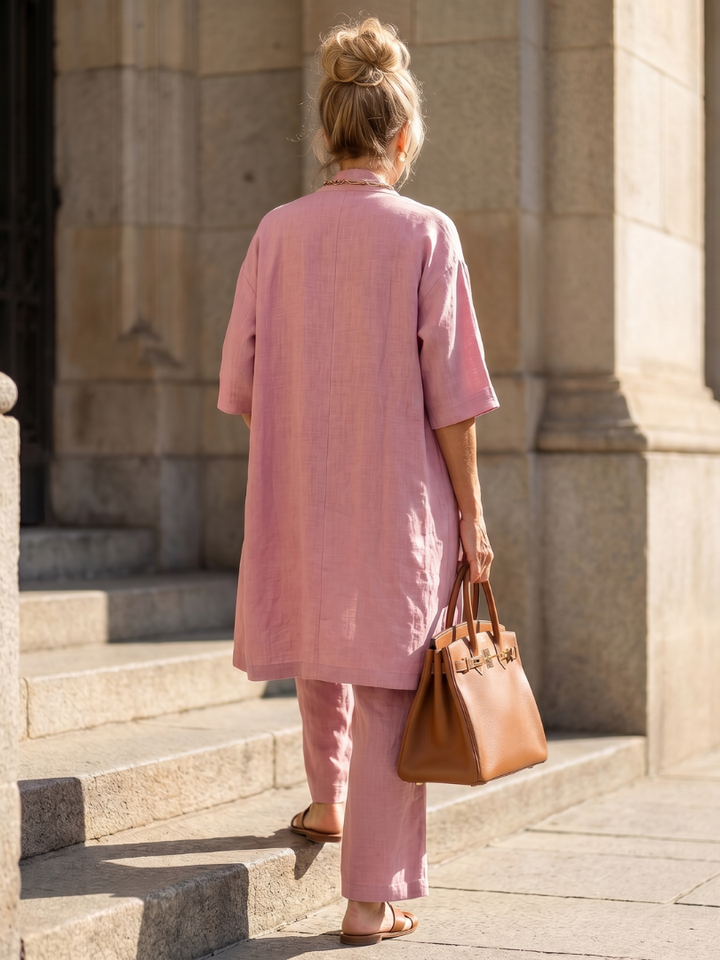 Matching women's casual three-piece set with a loose top, open cardigan, and flowing wide-leg pants.