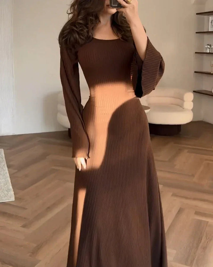 Women's chic long-sleeve maxi dress in a beautiful, flowing fabric. Great for day or evening.