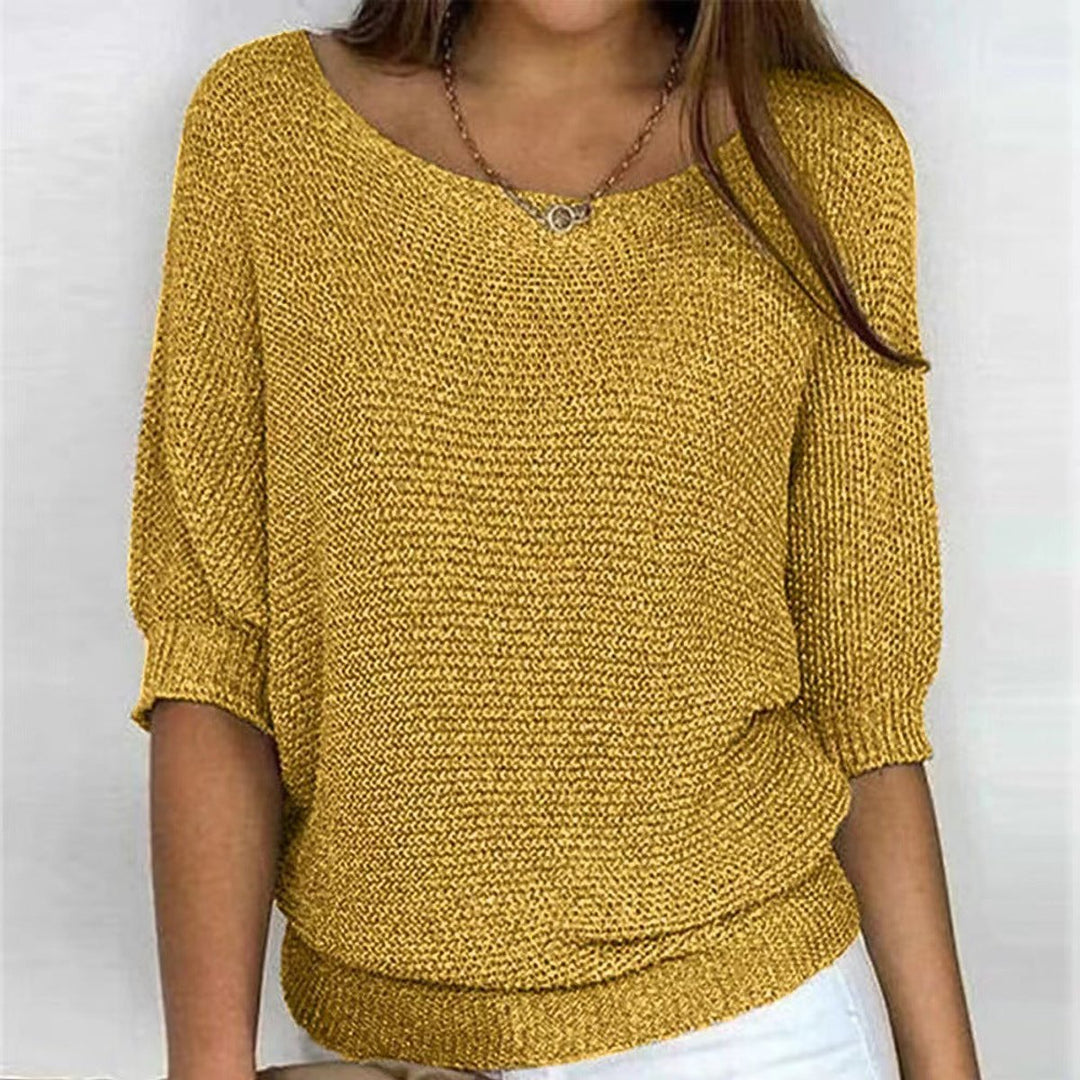 Women's round neck batwing sweater. Oversized knit top for a relaxed, stylish, and cozy winter look.