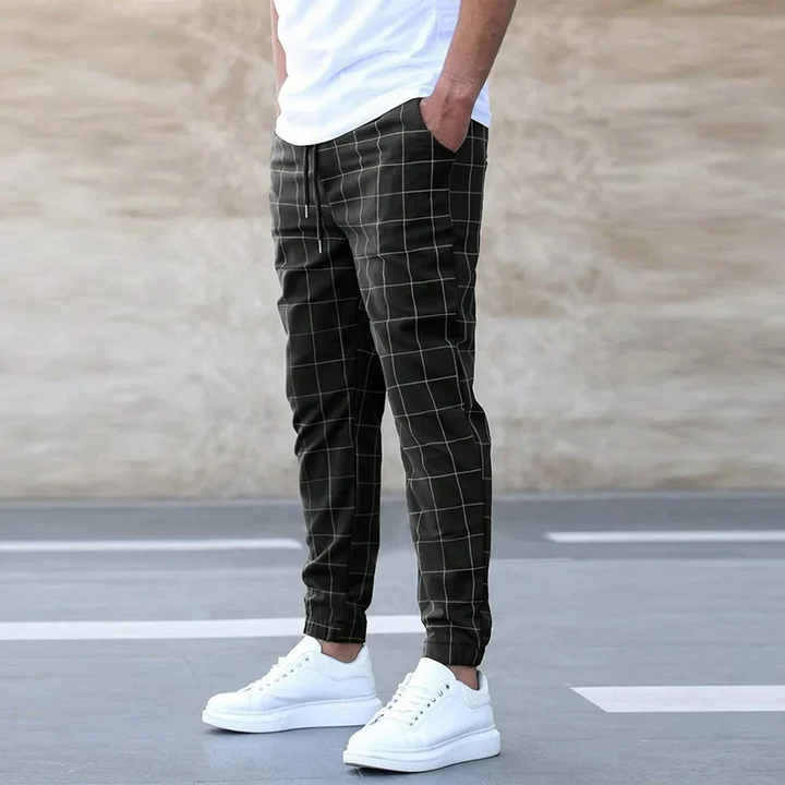 Khaki plaid men's joggers, offering a comfortable tapered fit for versatile casual wear and fashion statements.