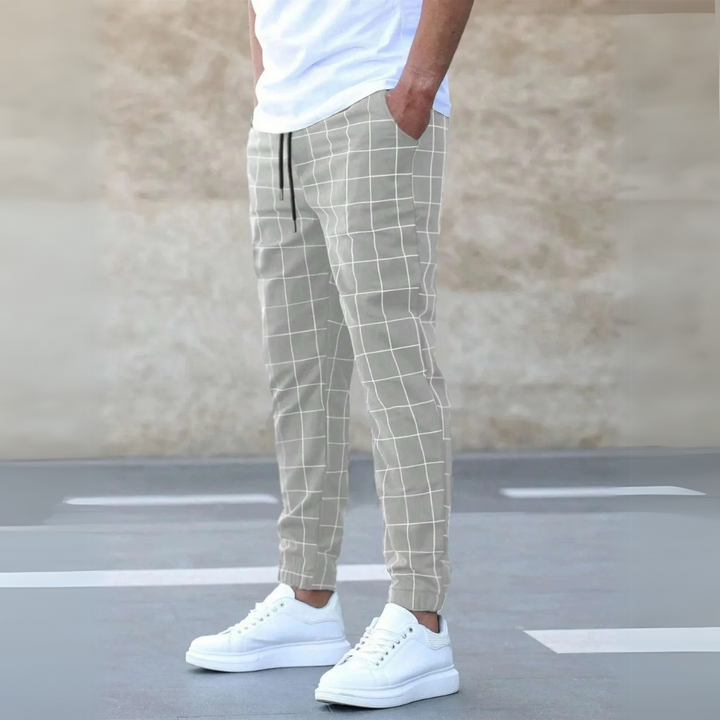 Stylish men's plaid tapered joggers, designed for comfort and a modern fashion-forward casual streetwear aesthetic.