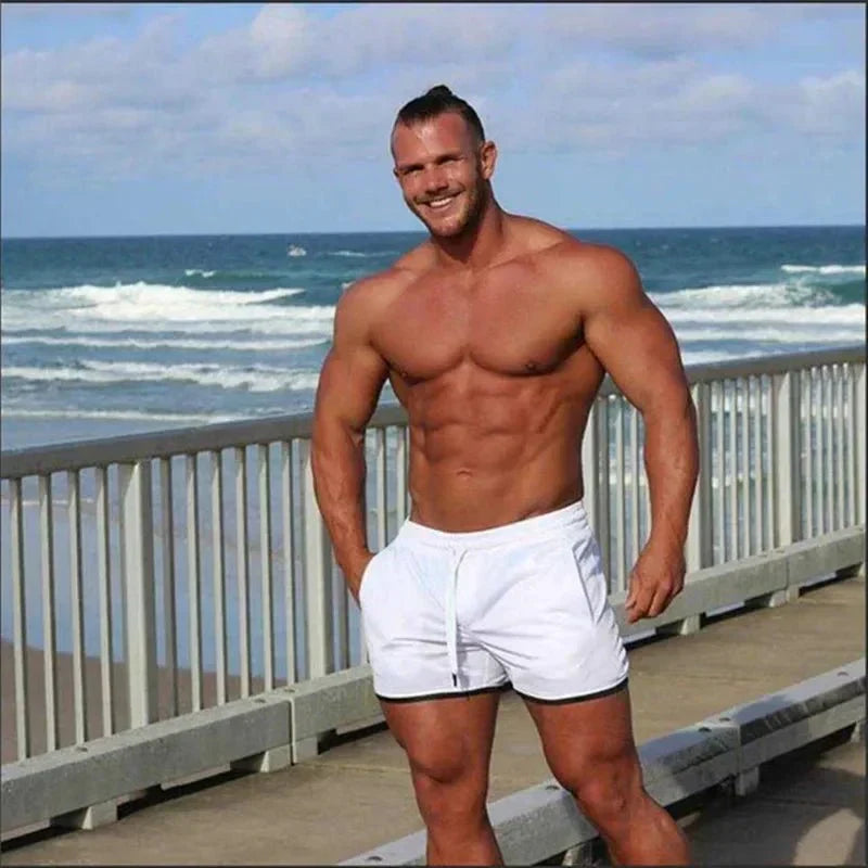 Comfortable men's quick-dry drawstring swim shorts, essential beachwear & pool shorts for summer.