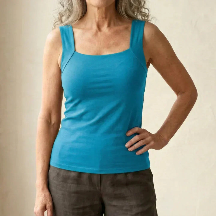 Fitted women's square neck tank with a built-in bra, offering a sleek and smooth look.