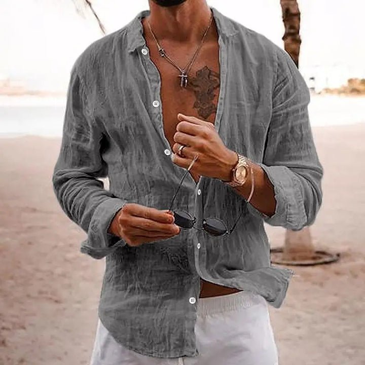 Relaxed fit men's long sleeve button-down shirt; casual style for warm weather fashion.