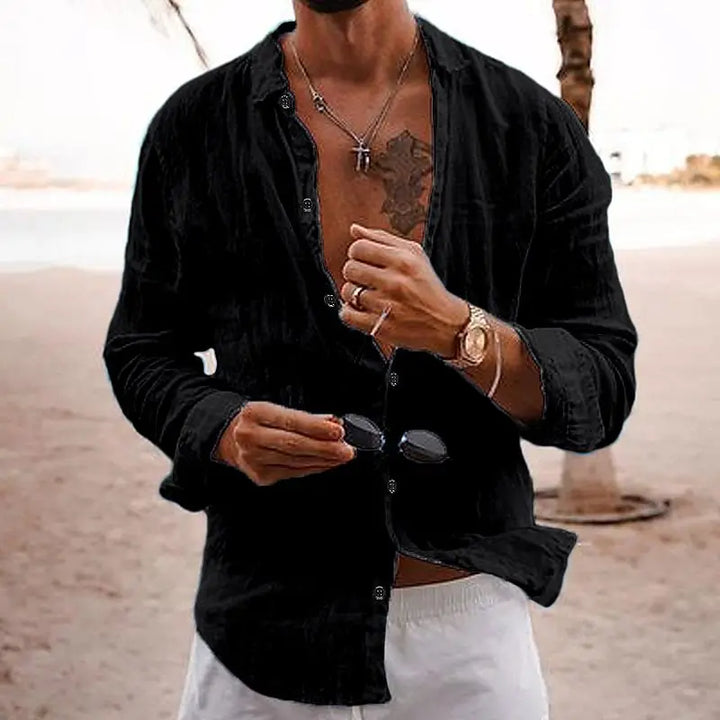 Collared men's long sleeve button-down shirt; relaxed fit, ideal for warm weather casual fashion.